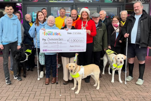 Swindon Bats Bowlers with Jane from Asda Orbital collecting our grant Cheque from the the Asda Foundation outside Tenpin bowling Alley.