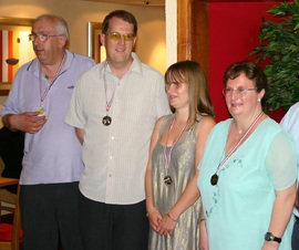 Cliff, Tom, Nicky and Tracy receiving their medals